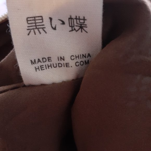 Black Butterfly Canvas Backpack in a Blue Floral Print - Picture 11 of 12